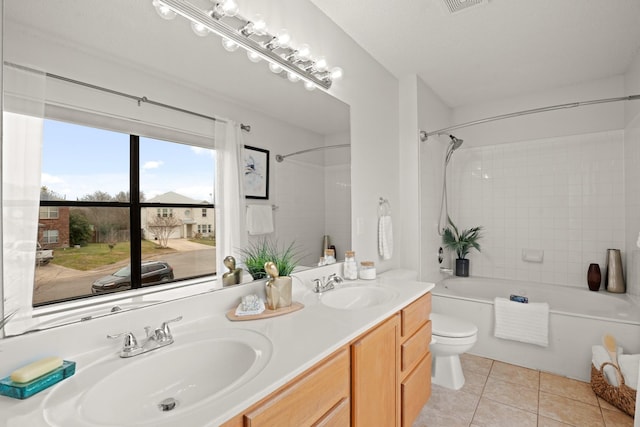 full bathroom featuring tile patterned flooring, vanity, toilet, and shower / bath combination