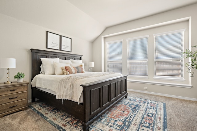 bedroom featuring vaulted ceiling and carpet