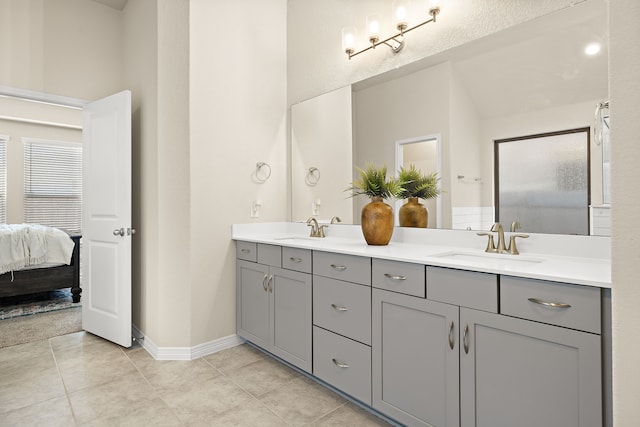 bathroom with tile patterned flooring and vanity