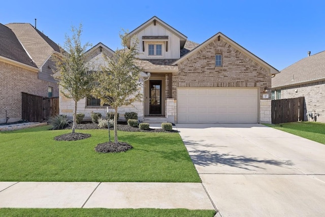 craftsman inspired home featuring a garage and a front yard