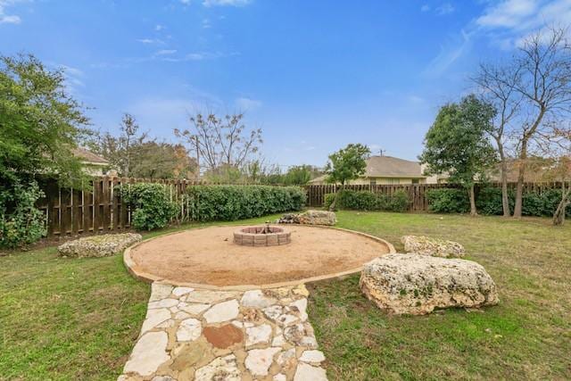 view of yard with an outdoor fire pit