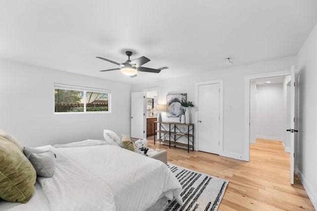 bedroom with wood-type flooring and ceiling fan