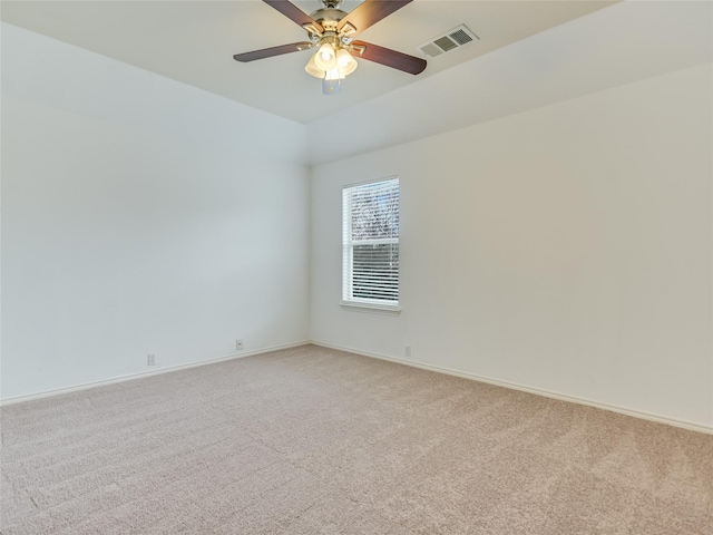 carpeted empty room featuring ceiling fan