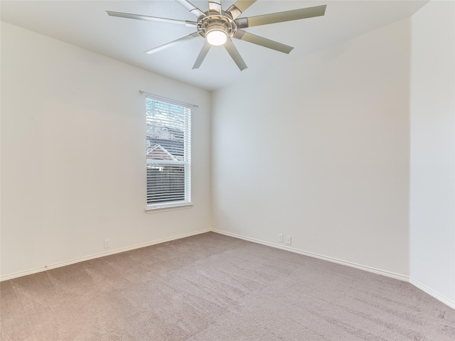 empty room with light carpet and ceiling fan