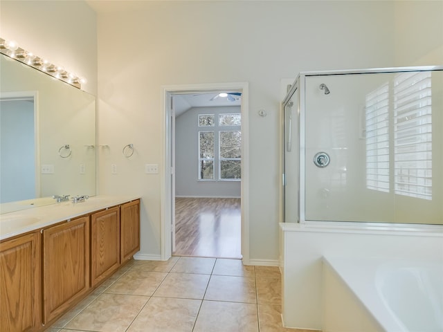 bathroom with tile patterned flooring, vanity, and separate shower and tub