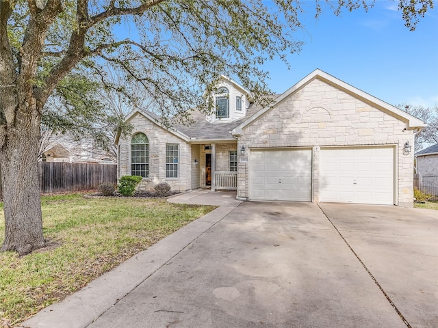 view of front property with a garage and a front yard