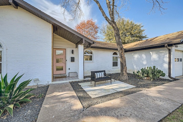 doorway to property featuring a garage