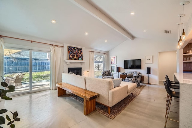 living room featuring beamed ceiling, a fireplace, and high vaulted ceiling