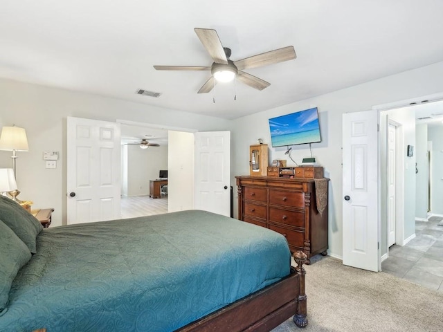 bedroom with light colored carpet and ceiling fan