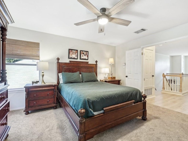 bedroom featuring ceiling fan and light colored carpet