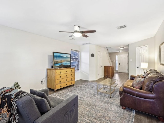 living room with ceiling fan and hardwood / wood-style floors