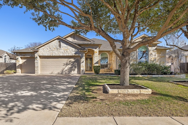 view of front facade with a garage and a front lawn