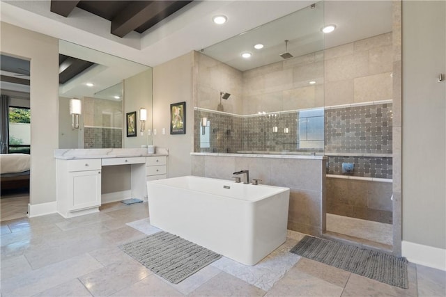 bathroom featuring vanity and shower with separate bathtub