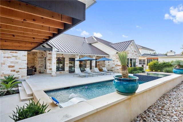 view of pool with a patio area