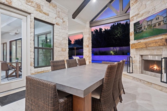 107 Bisset Ct, Austin, TX 78738 - view of patio / terrace featuring an outdoor stone fireplace and outdoor dining space