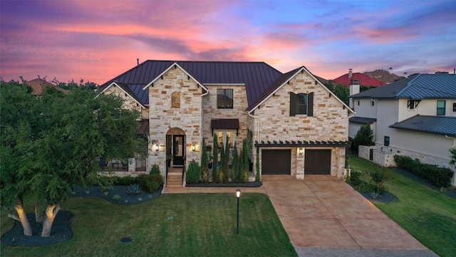 107 Bisset Ct, Austin, TX 78738 - french country home featuring a lawn, stone siding, a standing seam roof, and driveway
