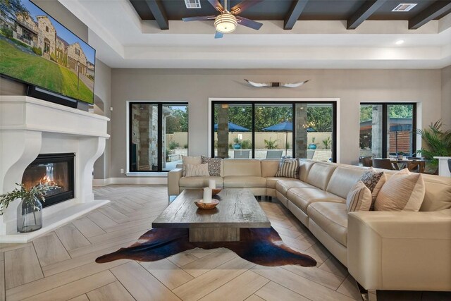 107 Bisset Ct, Austin, TX 78738 - living room with a large fireplace, a ceiling fan, and beamed ceiling