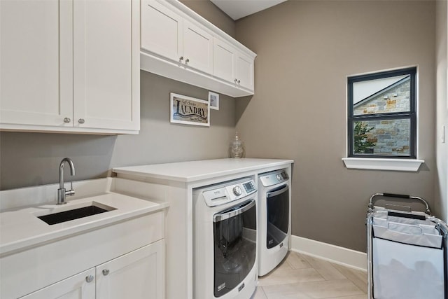 107 Bisset Ct, Austin, TX 78738 - clothes washing area with light tile patterned floors, a sink, separate washer and dryer, cabinet space, and baseboards