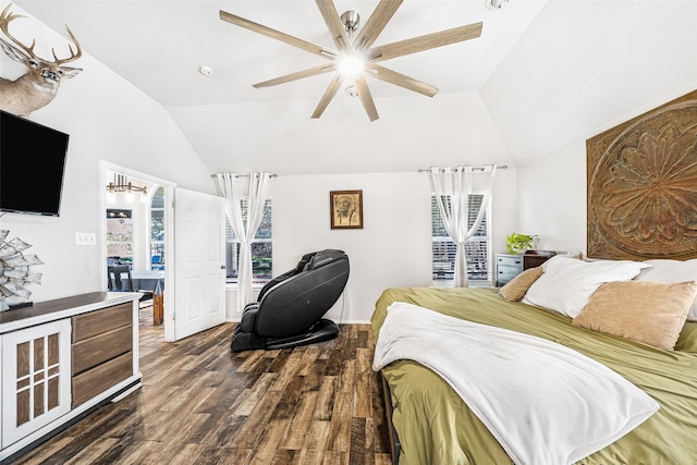 bedroom with ceiling fan, dark hardwood / wood-style floors, and vaulted ceiling