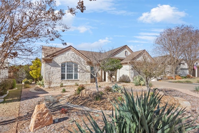 215 Goose Island Dr, Georgetown, TX 78633 - view of front of house with stone siding and driveway