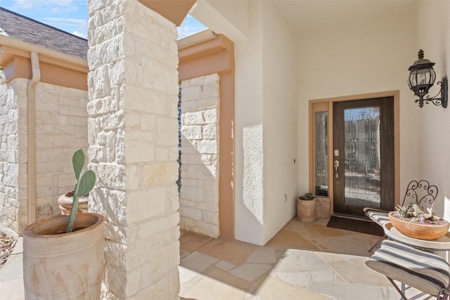 215 Goose Island Dr, Georgetown, TX 78633 - property entrance with stucco siding and a shingled roof