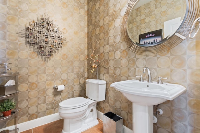 bathroom with tile patterned flooring and toilet