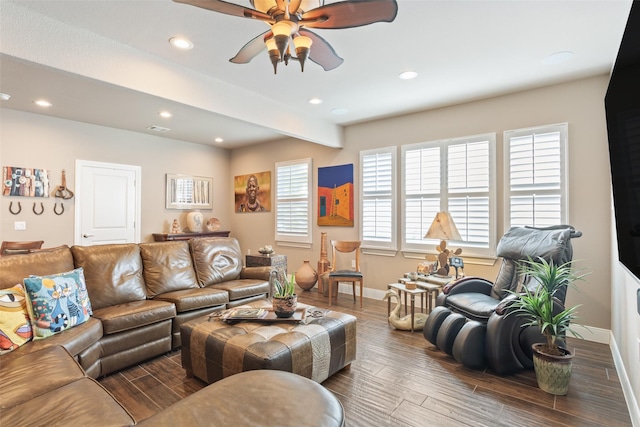 living room featuring beamed ceiling, wood-type flooring, a wealth of natural light, and ceiling fan