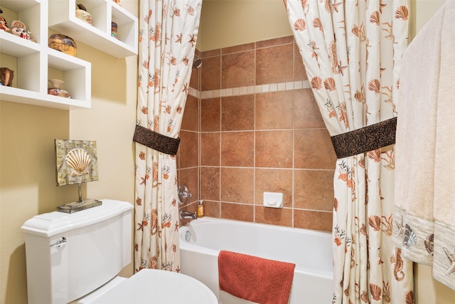 bathroom with toilet and shower / tub combo