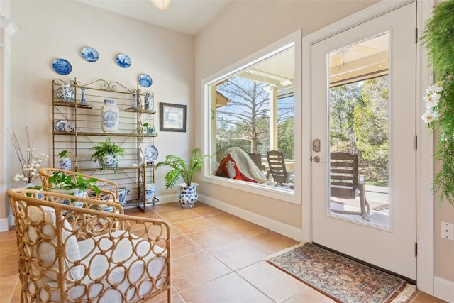 215 Goose Island Dr, Georgetown, TX 78633 - doorway with healthy amount of natural light, tile patterned floors, and baseboards