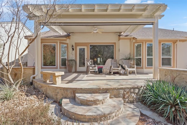 215 Goose Island Dr, Georgetown, TX 78633 - back of property featuring ceiling fan, stucco siding, a patio area, and a shingled roof