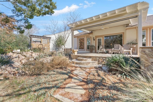 215 Goose Island Dr, Georgetown, TX 78633 - rear view of house featuring stucco siding and a ceiling fan