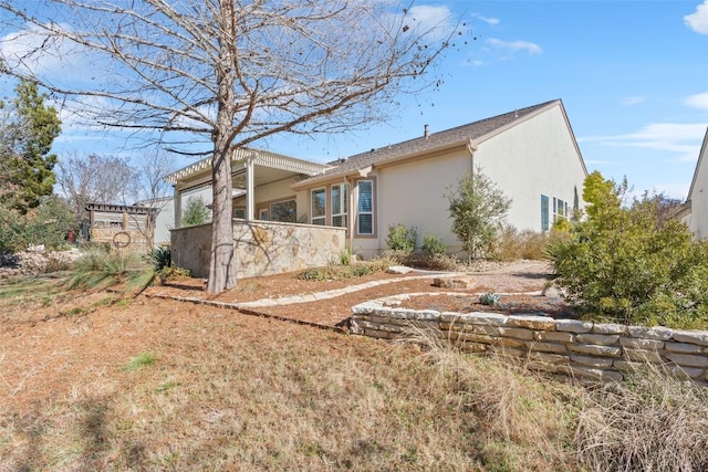 215 Goose Island Dr, Georgetown, TX 78633 - view of side of home featuring stucco siding