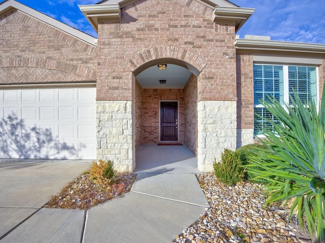 view of exterior entry featuring a garage