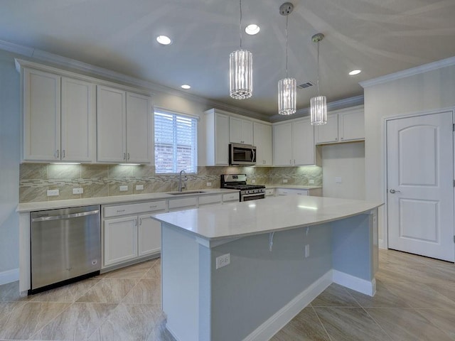 kitchen featuring appliances with stainless steel finishes, sink, and white cabinets