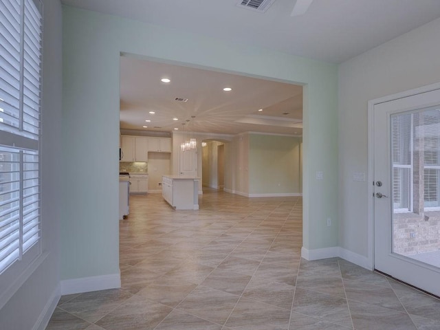 interior space featuring a healthy amount of sunlight and light tile patterned floors