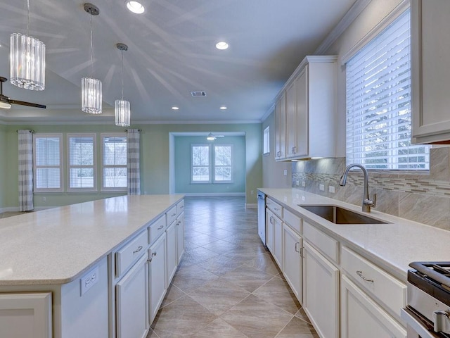 kitchen with sink, backsplash, and white cabinets