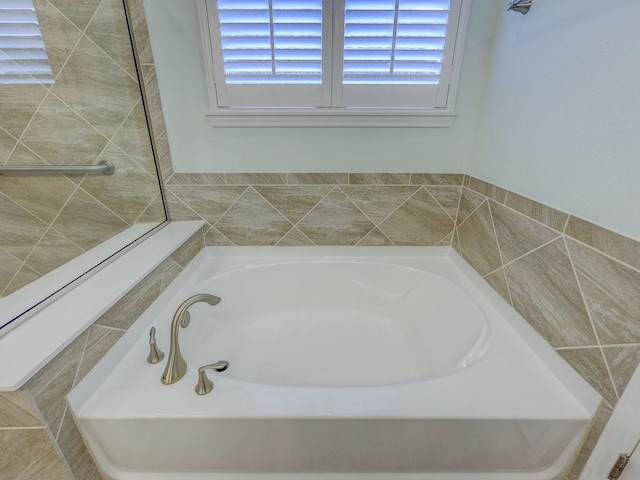 bathroom featuring a tub to relax in