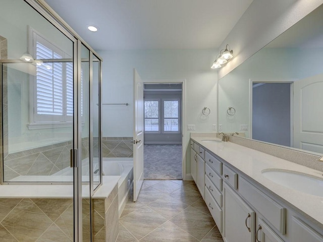 bathroom with tile patterned floors, plus walk in shower, and vanity