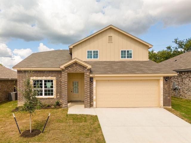 view of front of home featuring a garage, a front yard, and cooling unit