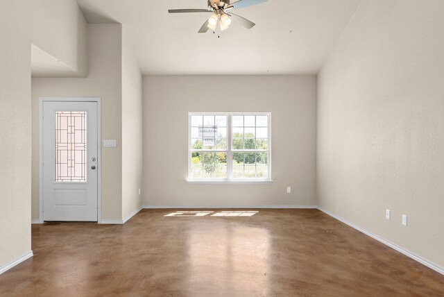 entryway featuring ceiling fan and concrete flooring