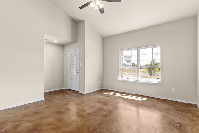 empty room featuring high vaulted ceiling, concrete flooring, and ceiling fan