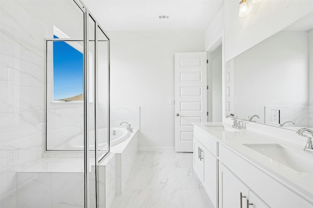 143 Big Pine Creek Ln, Bastrop, TX 78602 - bathroom featuring marble look tiles, a bath, double vanity, a stall shower, and baseboards