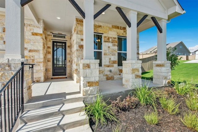 143 Big Pine Creek Ln, Bastrop, TX 78602 - doorway to property with stone siding and a porch
