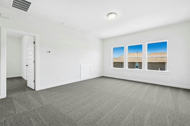 143 Big Pine Creek Ln, Bastrop, TX 78602 - spare room with dark colored carpet and baseboards