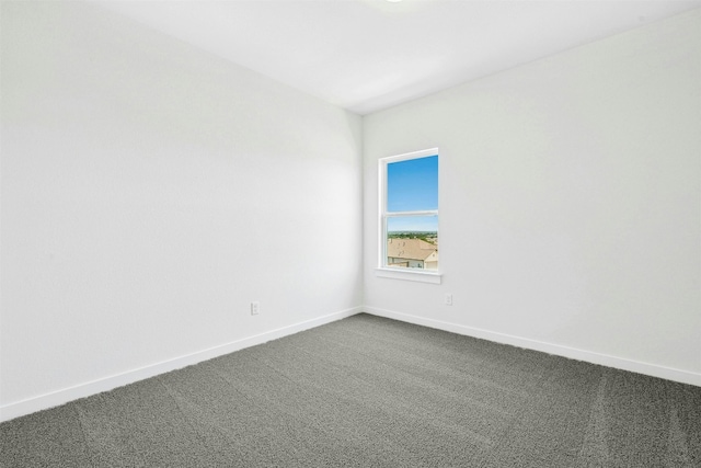 143 Big Pine Creek Ln, Bastrop, TX 78602 - unfurnished room featuring dark colored carpet and baseboards