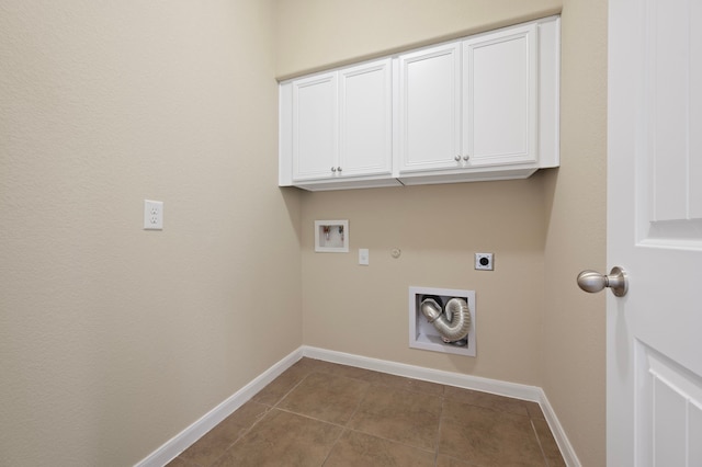 washroom with gas dryer hookup, cabinets, washer hookup, tile patterned floors, and hookup for an electric dryer