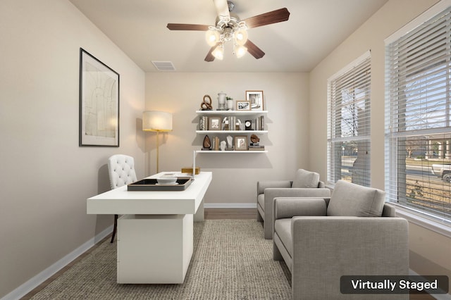 office space featuring hardwood / wood-style floors and ceiling fan