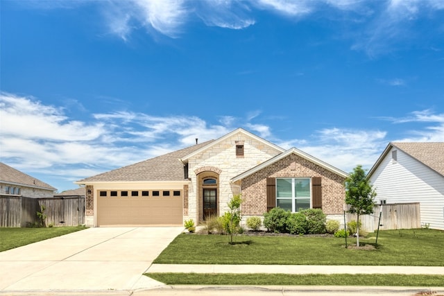 view of front facade featuring a garage and a front lawn