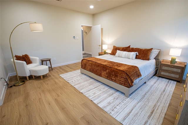 bedroom with light hardwood / wood-style floors