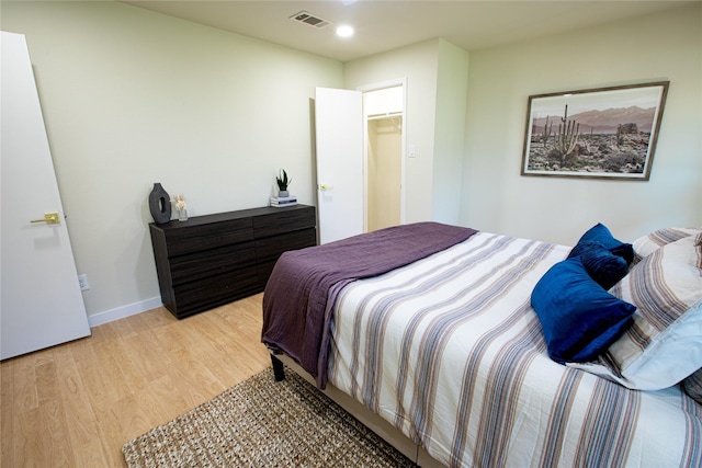 bedroom featuring light hardwood / wood-style floors